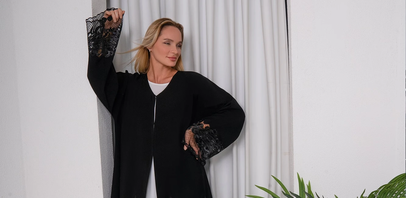 a black abaya with lace embroidery
