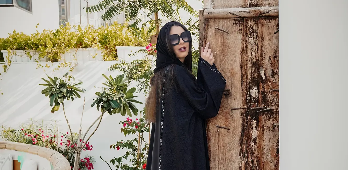 a black abaya with stitching