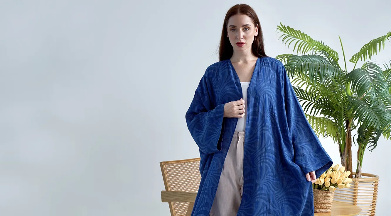 Trousers worn underneath an open abaya