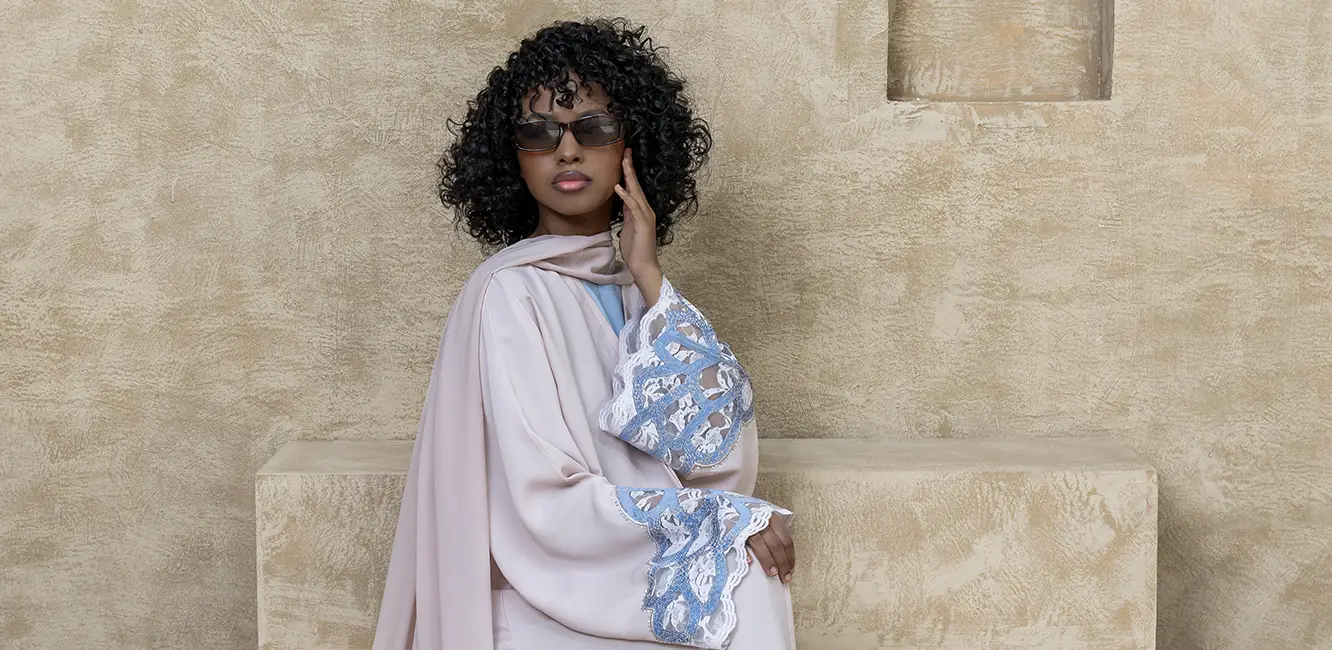 An abaya embellished with lace
